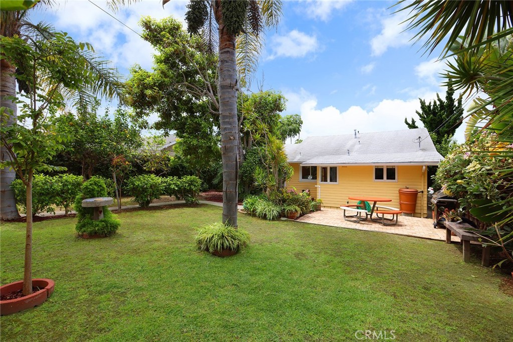 556 Through Street Laguna Beach, CA 92651 - Photo 21 of 30 a front view of a house with garden and sitting area