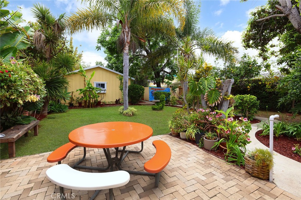 556 Through Street Laguna Beach, CA 92651 - Photo 22 of 30 a view of a swimming pool with a yard and plants