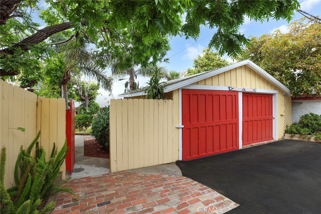 556 Through Street Laguna Beach, CA 92651 - Photo 25 of 30 a view of a small house with wooden fence