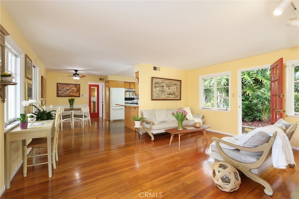 556 Through Street Laguna Beach, CA 92651 - Photo 9 of 30 a living room with furniture floor to ceiling window and wooden floor