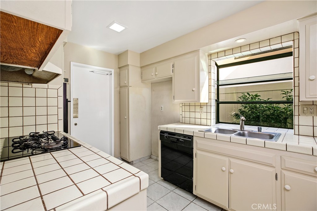 223 Orange Street Newport Beach, CA 92663 - Photo 17 of 51 a kitchen with a sink appliances and cabinets
