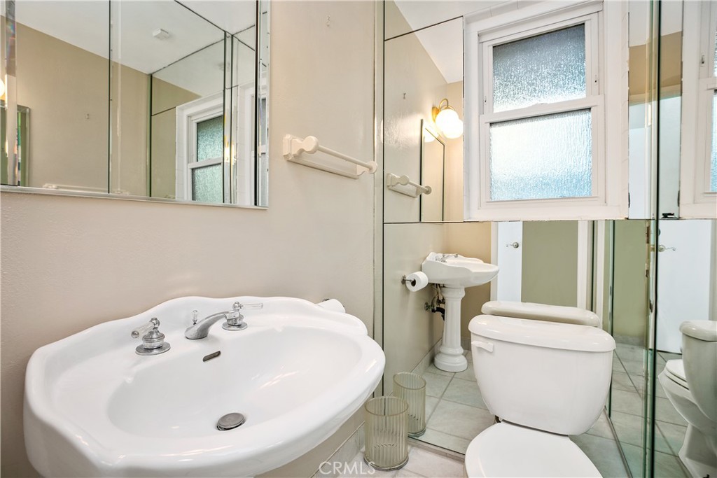 223 Orange Street Newport Beach, CA 92663 - Photo 19 of 51 a bathroom with a toilet sink and mirror