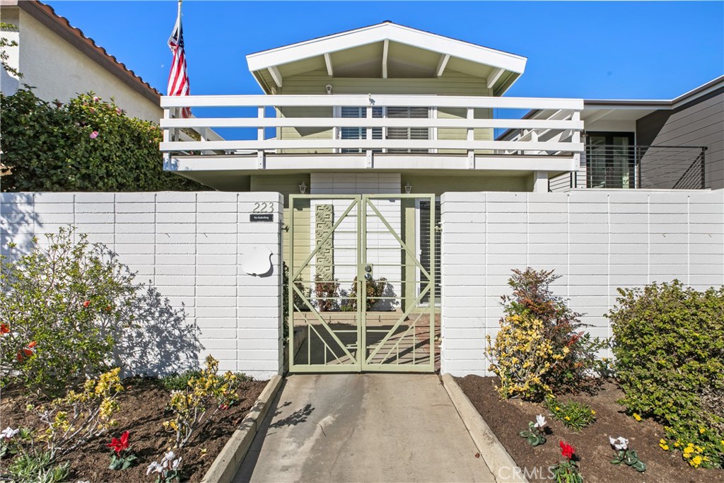 223 Orange Street Newport Beach, CA 92663 - Photo 2 of 51 a roof deck with table and potted plants