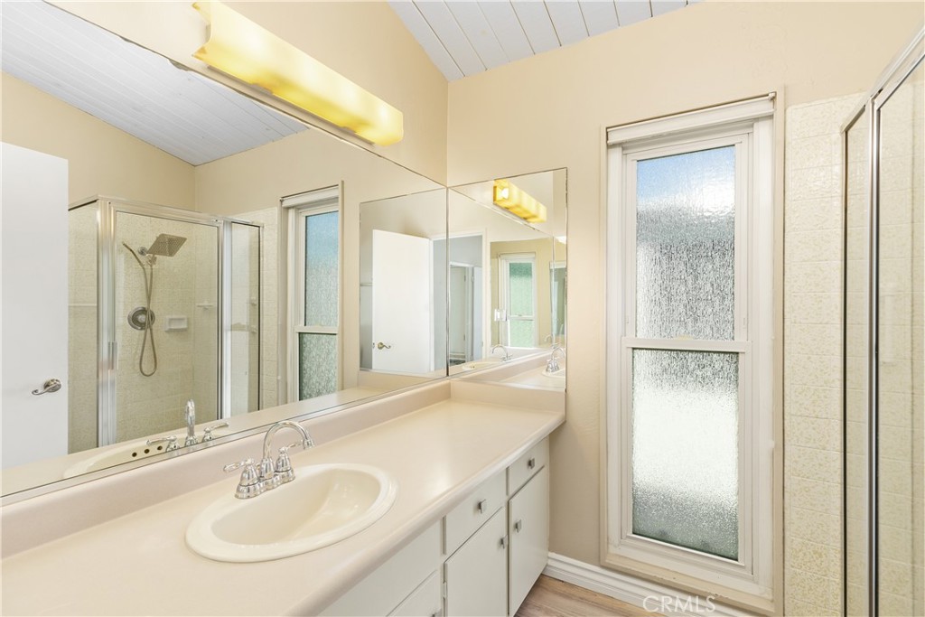 223 Orange Street Newport Beach, CA 92663 - Photo 26 of 51 a bathroom with a sink and a mirror