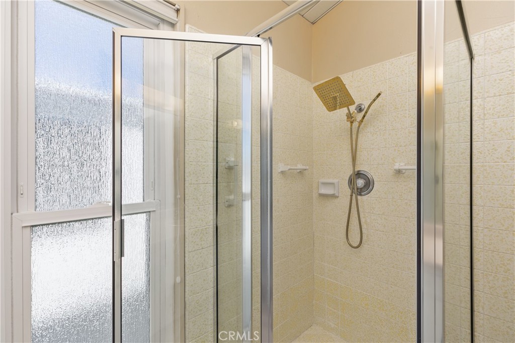 223 Orange Street Newport Beach, CA 92663 - Photo 27 of 51 a bathroom with a glass shower door