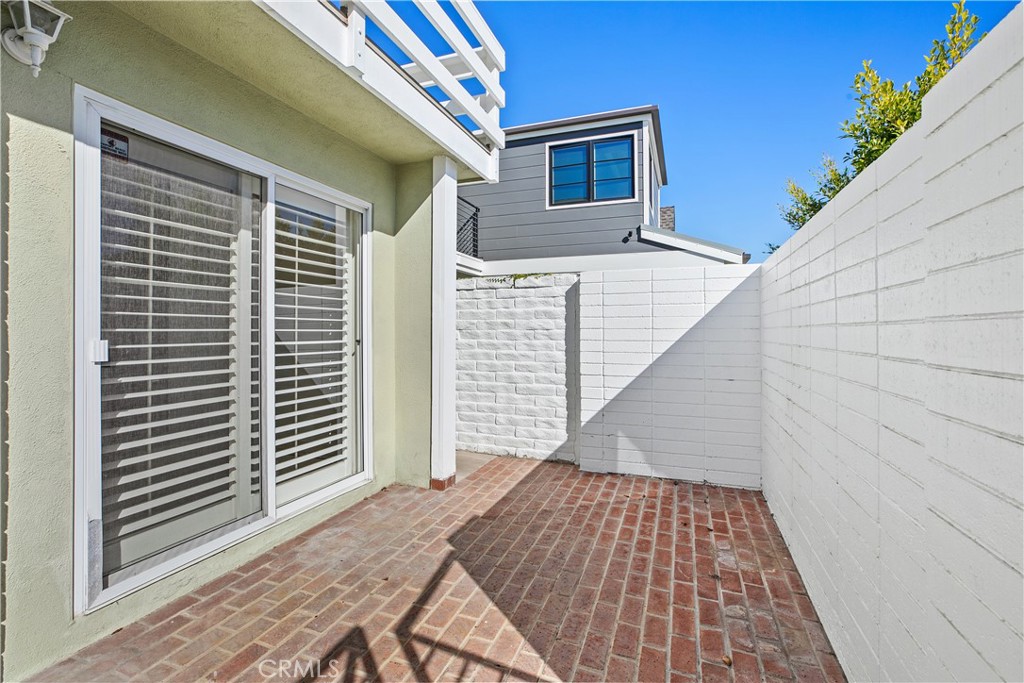 223 Orange Street Newport Beach, CA 92663 - Photo 3 of 51 a view of a balcony with wooden floor and fence