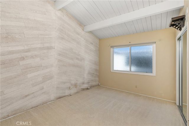 a bathroom with a bathtub shower sink vanity and mirror