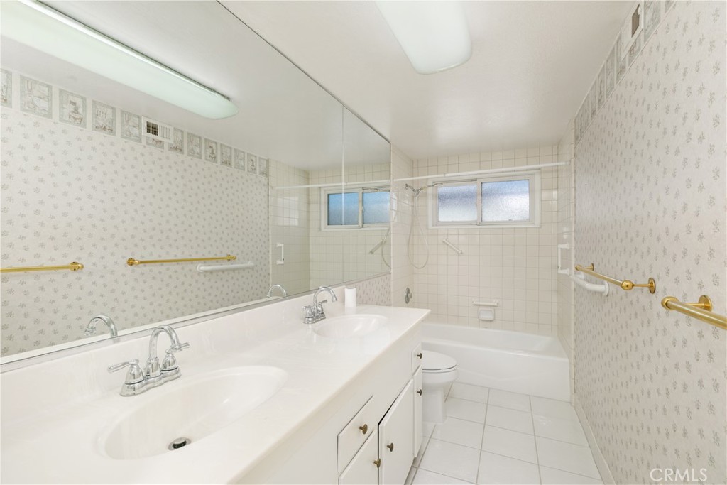 223 Orange Street Newport Beach, CA 92663 - Photo 34 of 51 a bathroom with a bathtub shower sink vanity and mirror