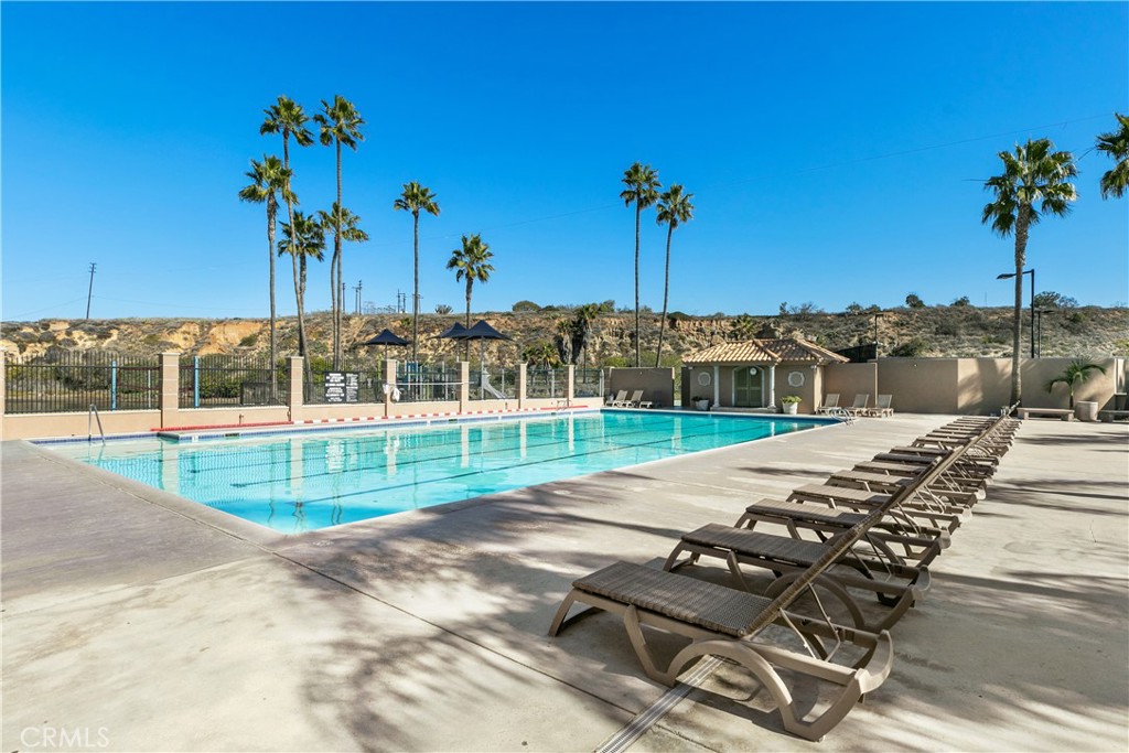 223 Orange Street Newport Beach, CA 92663 - Photo 37 of 51 a view of a swimming pool with a yard