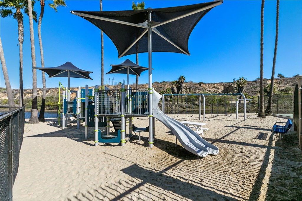 223 Orange Street Newport Beach, CA 92663 - Photo 40 of 51 a view of a patio with a table and chairs under an umbrella
