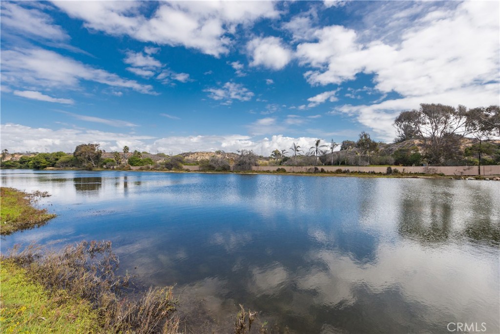 223 Orange Street Newport Beach, CA 92663 - Photo 49 of 51 a view of a lake with houses in the back