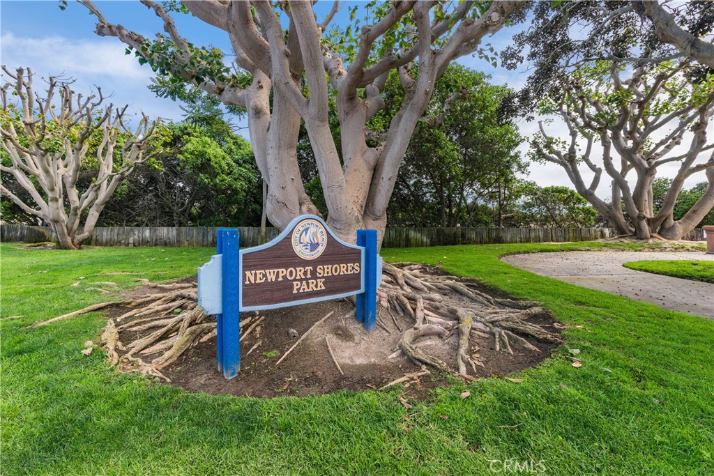223 Orange Street Newport Beach, CA 92663 - Photo 50 of 51 a sign that is sitting in the grass near a tree