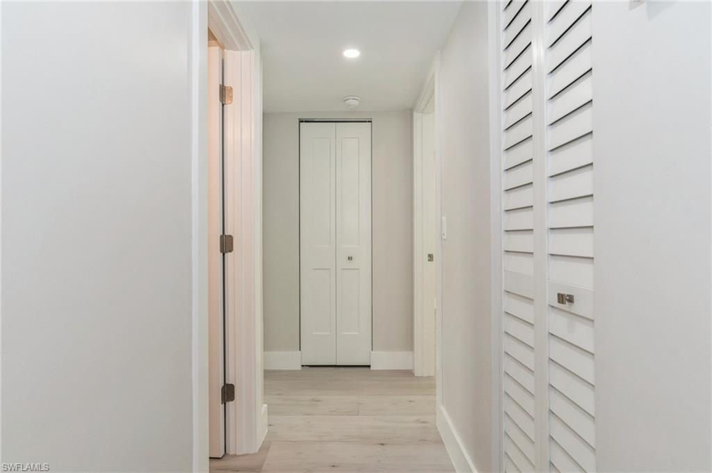 1155 Sandpiper Street, Unit B3 Naples, FL 34102 - Photo 15 of 21 Hall with light wood-style floors and recessed lighting
