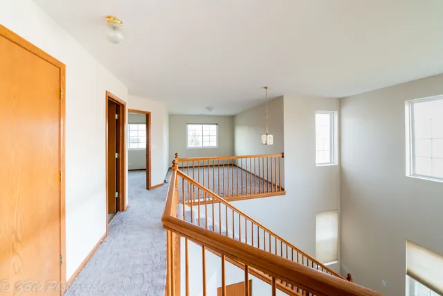 a view of entryway with bedroom and wooden floor