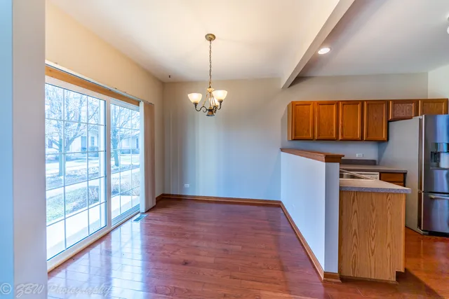 a view of kitchen with furniture wooden floor and window
