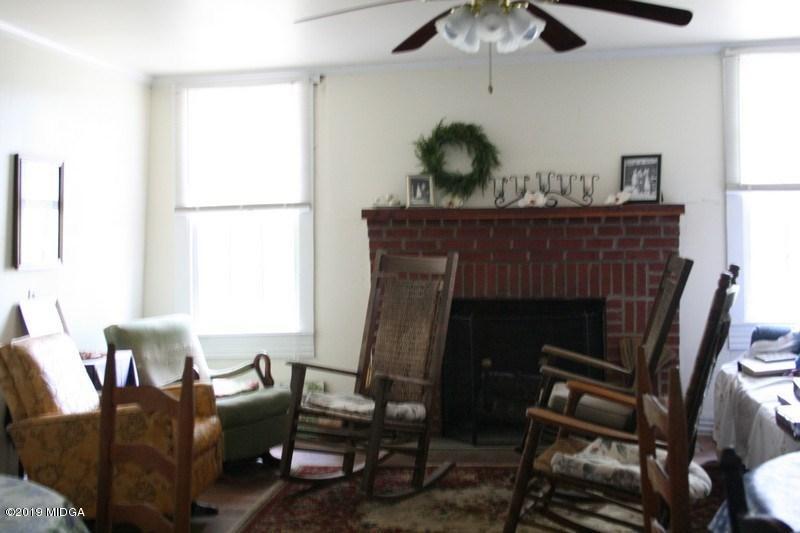 962 Durden Road Sandersville, GA 31082 - Photo 11 of 19 a living room with furniture and a fireplace