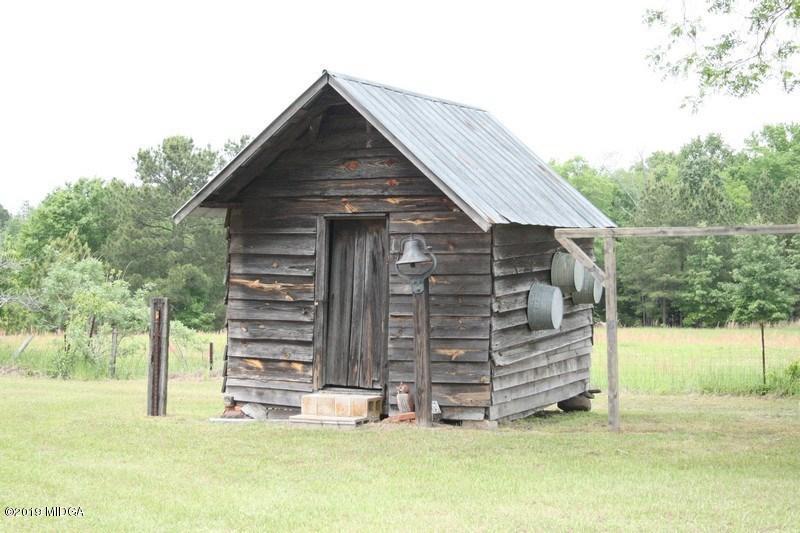 962 Durden Road Sandersville, GA 31082 - Photo 18 of 19 a view of wooden house with a yard