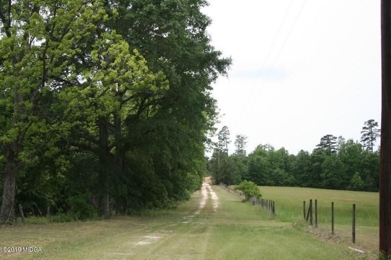 962 Durden Road Sandersville, GA 31082 - Photo 6 of 19 a view of a lake from a yard