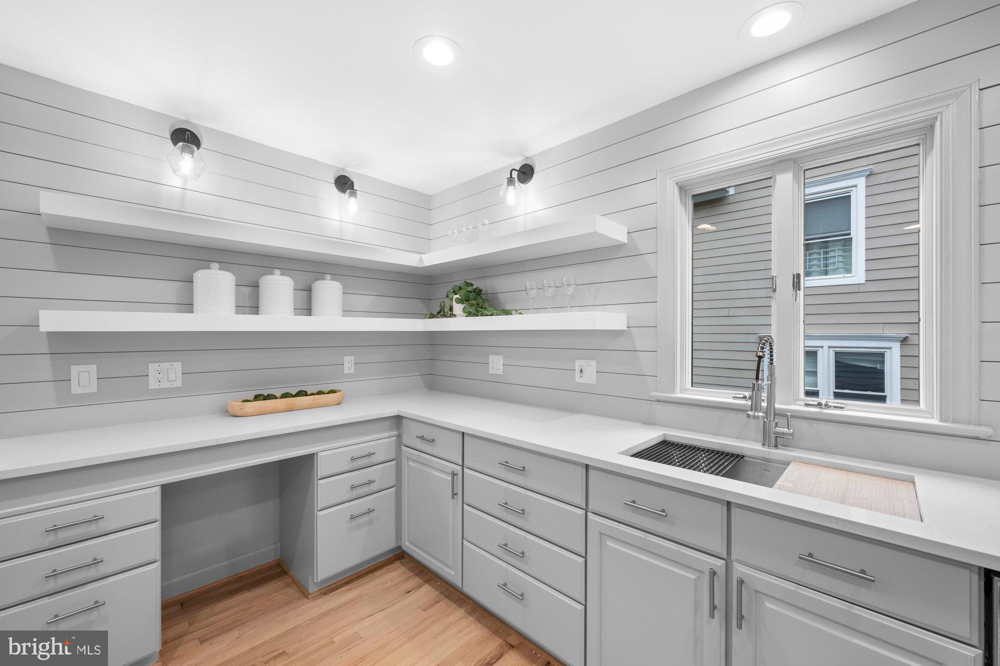 6856 St Albans Road McLean, VA 22101 - Photo 11 of 45 a kitchen with a sink cabinets and window