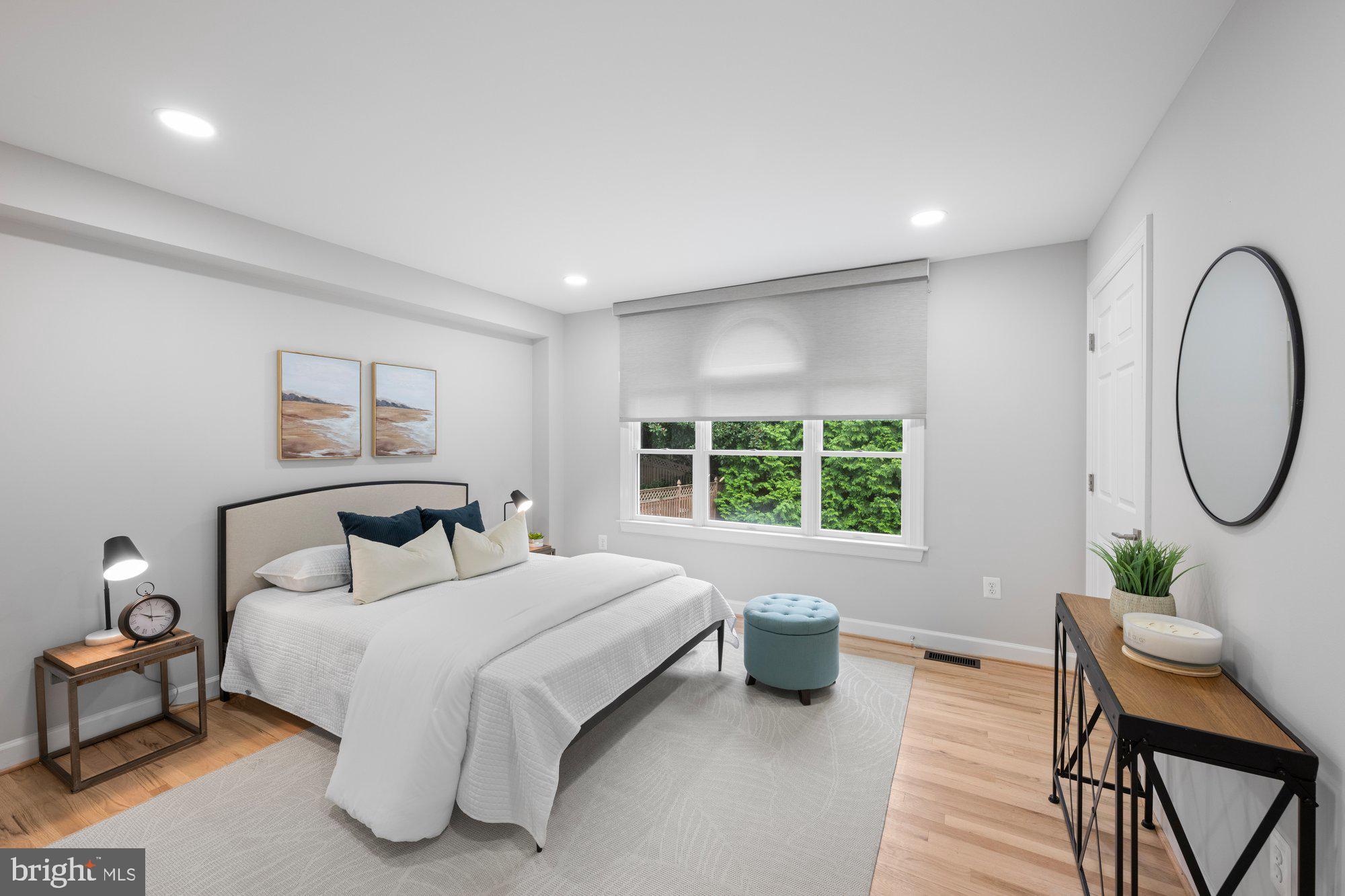 6856 St Albans Road McLean, VA 22101 - Photo 16 of 45 a bedroom with a bed a table and chair