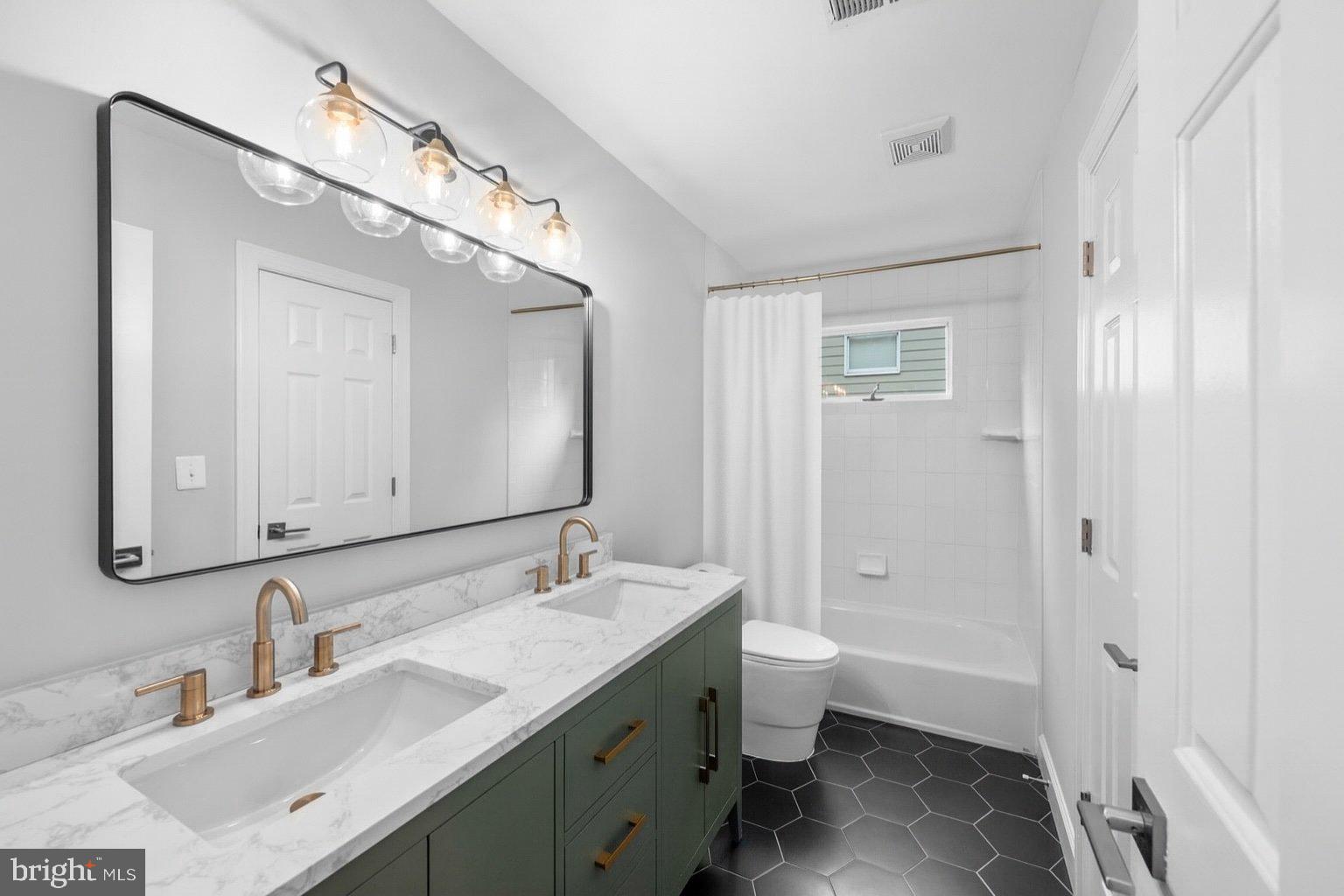 6856 St Albans Road McLean, VA 22101 - Photo 25 of 45 a bathroom with a double vanity sink mirror and toilet