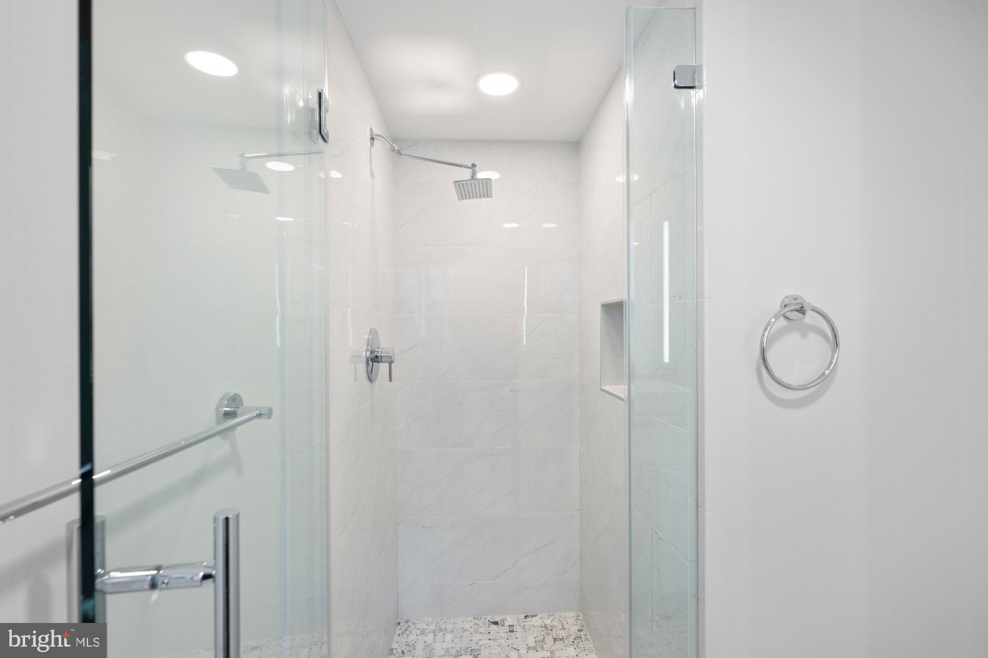 6856 St Albans Road McLean, VA 22101 - Photo 28 of 45 a bathroom with a shower