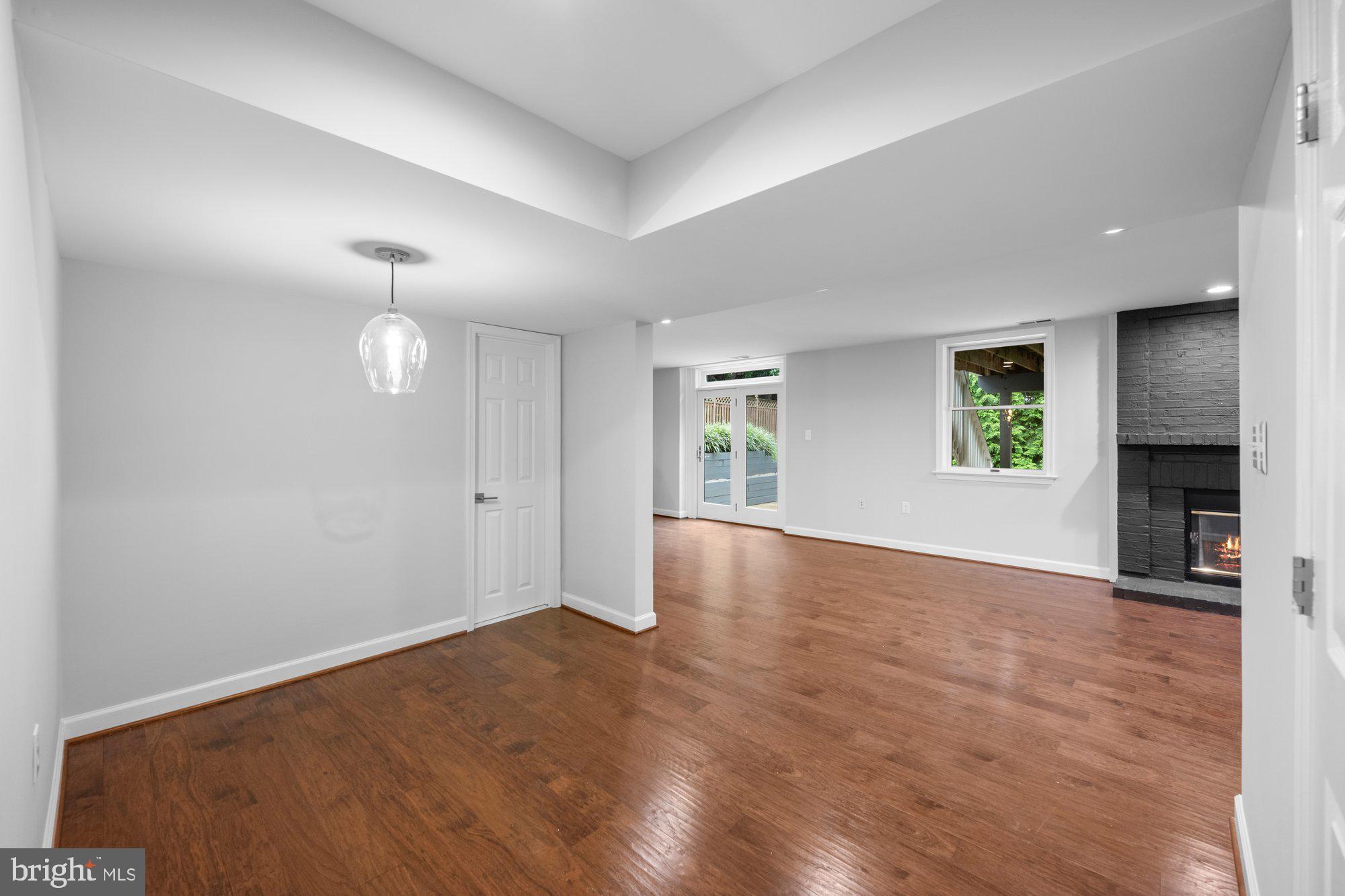 6856 St Albans Road McLean, VA 22101 - Photo 34 of 45 an empty room with windows and fireplace
