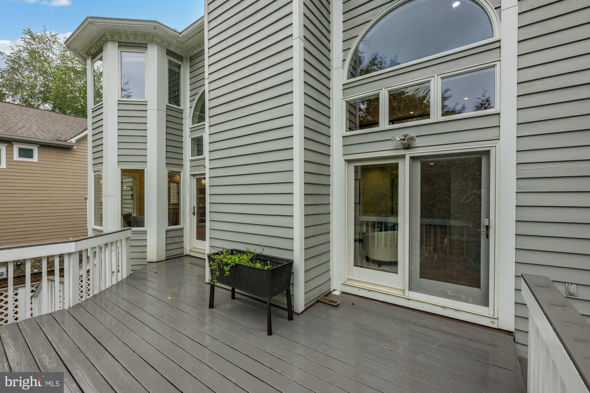 6856 St Albans Road McLean, VA 22101 - Photo 38 of 45 a balcony with furniture and wooden floor
