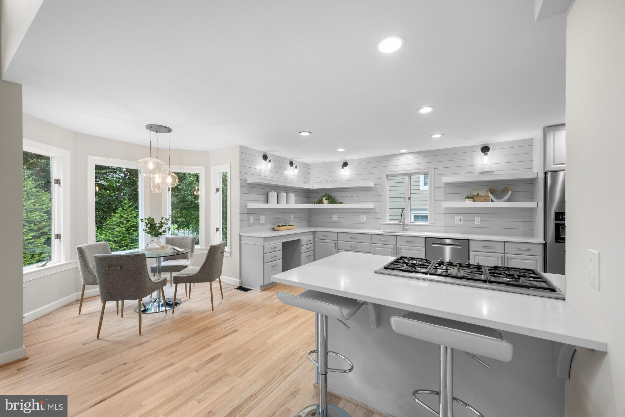 6856 St Albans Road McLean, VA 22101 - Photo 8 of 45 a kitchen with stainless steel appliances kitchen island granite countertop a sink and cabinets