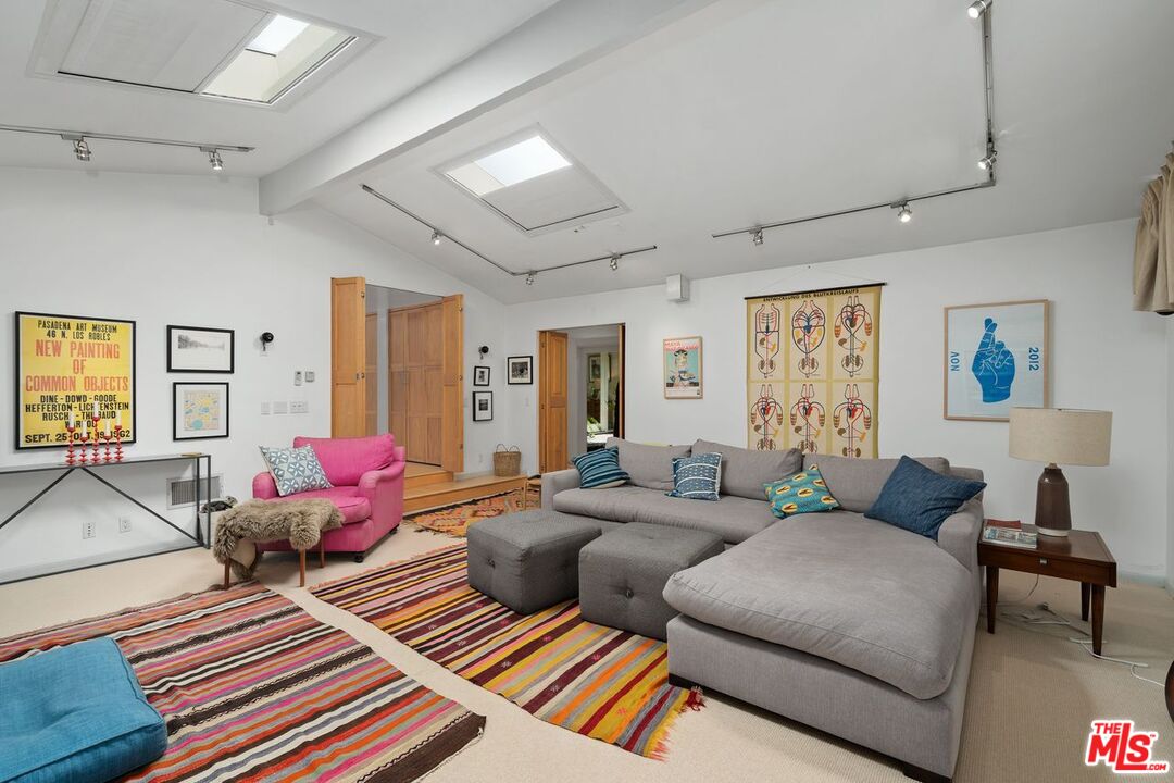 1827 Old Ranch Road Los Angeles, CA 90049 - Photo 17 of 39 a living room with furniture and a window