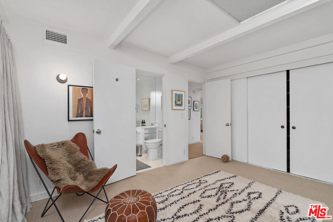1827 Old Ranch Road Los Angeles, CA 90049 - Photo 20 of 39 a bedroom with a bed and chair