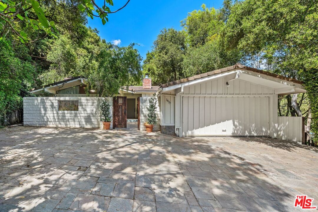 1827 Old Ranch Road Los Angeles, CA 90049 - Photo 2 of 39 a view of a house with a yard