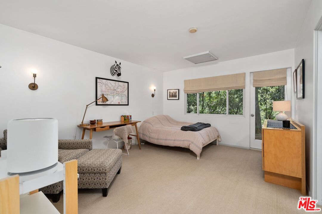 1827 Old Ranch Road Los Angeles, CA 90049 - Photo 23 of 39 a living room with furniture and a large window