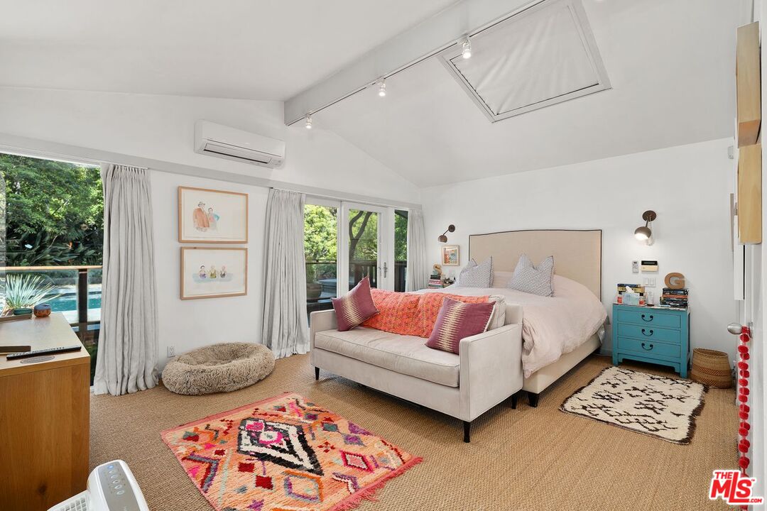 1827 Old Ranch Road Los Angeles, CA 90049 - Photo 25 of 39 a bedroom with furniture and a window