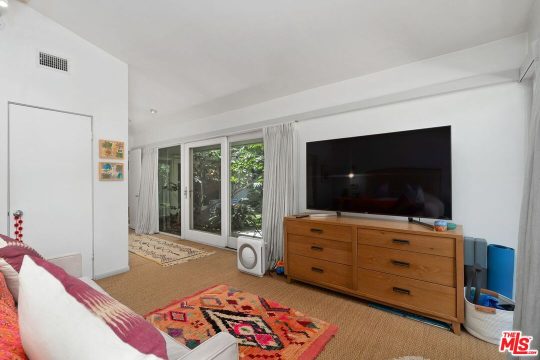 1827 Old Ranch Road Los Angeles, CA 90049 - Photo 27 of 39 a living room with furniture and a flat screen tv