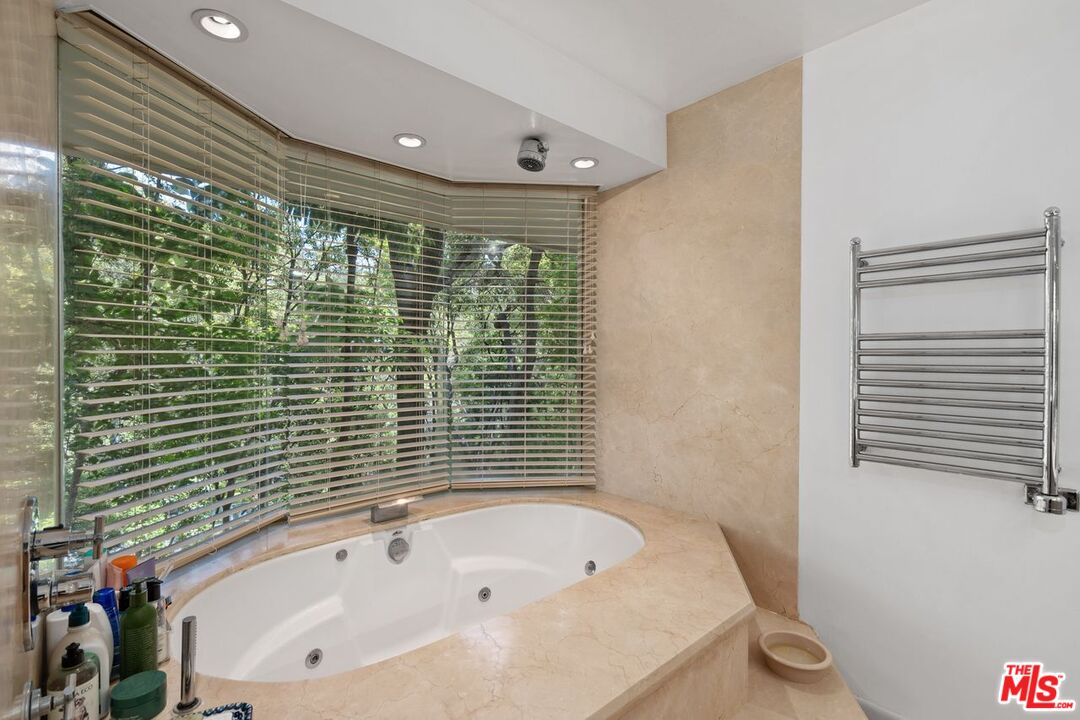 1827 Old Ranch Road Los Angeles, CA 90049 - Photo 29 of 39 a bathroom with a bathtub and shower