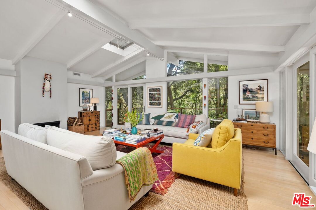 1827 Old Ranch Road Los Angeles, CA 90049 - Photo 5 of 39 a living room with furniture and a large window