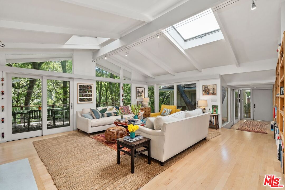 1827 Old Ranch Road Los Angeles, CA 90049 - Photo 6 of 39 a living room with furniture and large windows