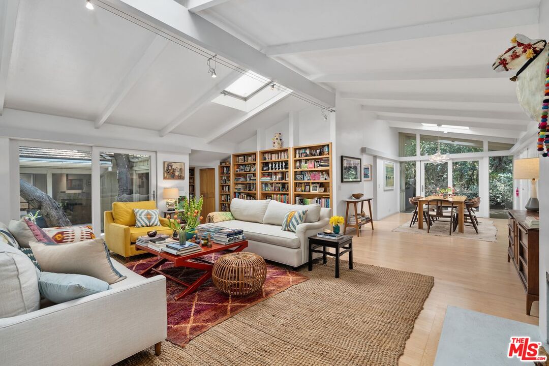1827 Old Ranch Road Los Angeles, CA 90049 - Photo 7 of 39 a living room with furniture and a large window