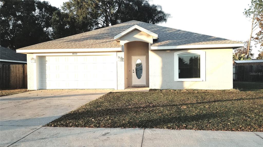4834 Timber Way Zephyrhills, FL 33542 - Photo 1 of 1 a front view of a house with a yard