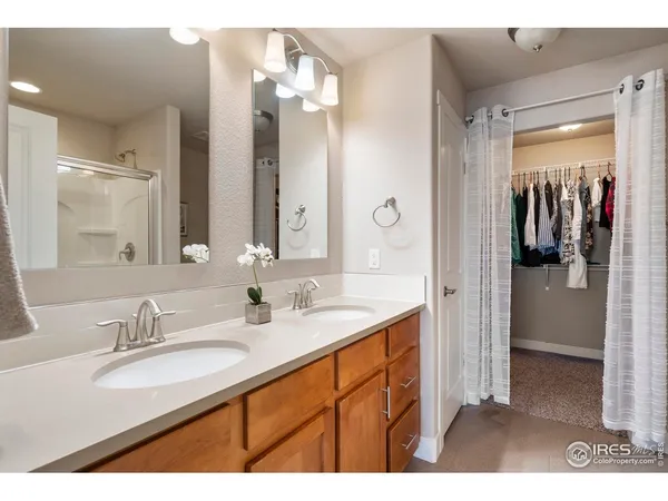 a bathroom with a sink double vanity and a mirror