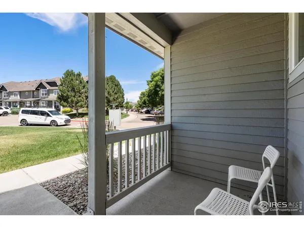 a view of backyard with deck and garden