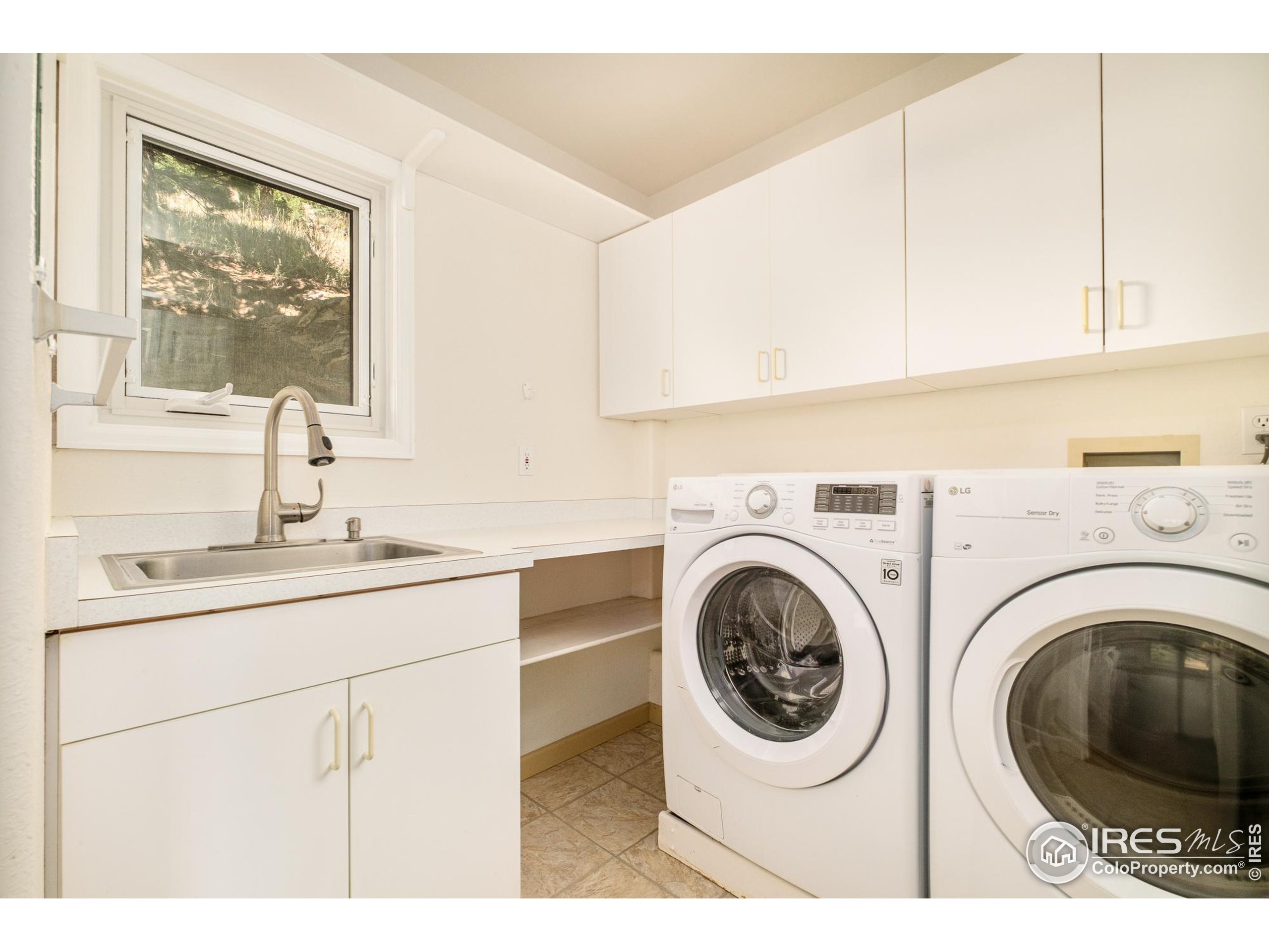 270 Canon View Road Boulder, CO 80302 - Photo 17 of 48 a utility room with sink dryer and washer