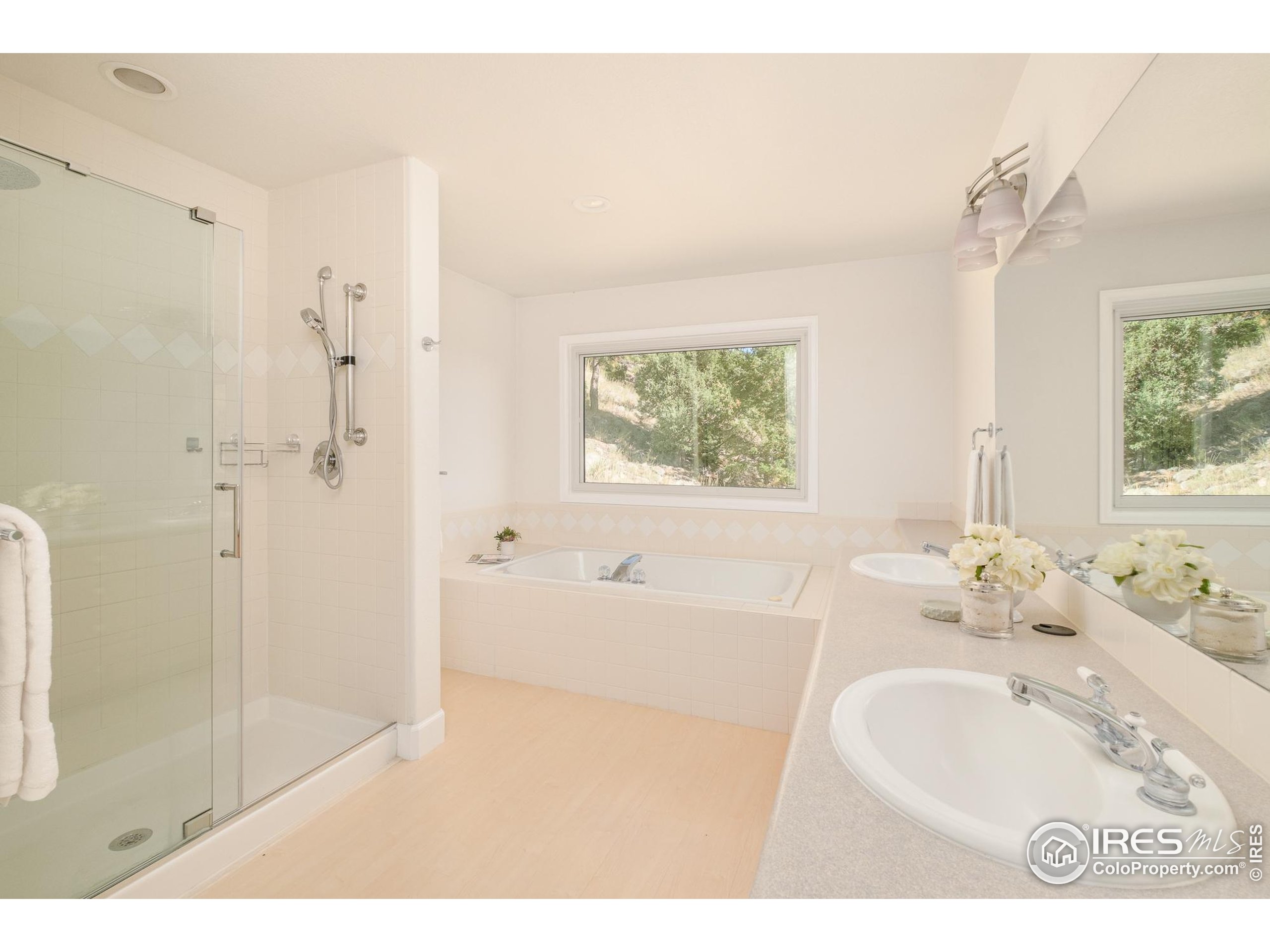 270 Canon View Road Boulder, CO 80302 - Photo 30 of 48 a bathroom with a tub sink shower and a mirror