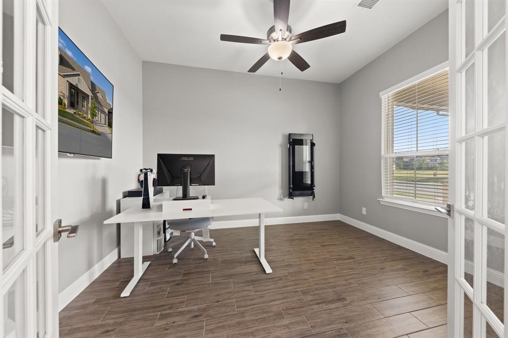 8808 Royal Star Road Rowlett, TX 75089 - Photo 15 of 40 a work room with furniture wooden floor and a window