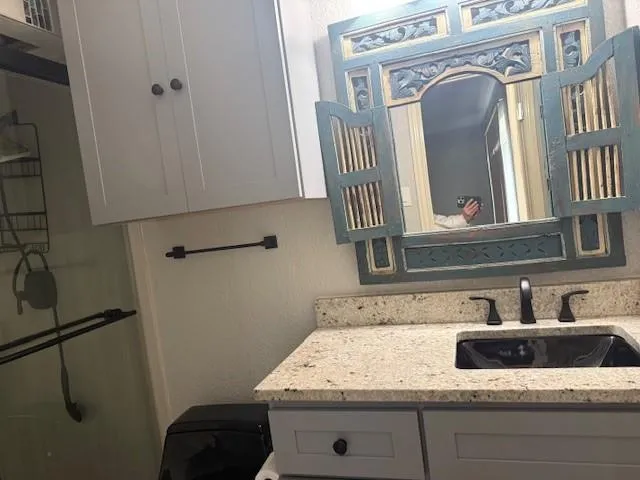 a bathroom with a sink and a mirror