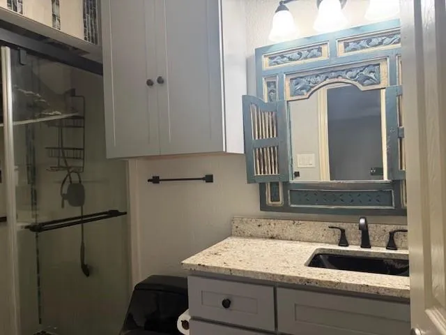 a bathroom with a sink and a mirror