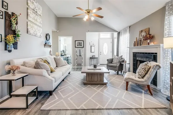 a living room with furniture and a fireplace