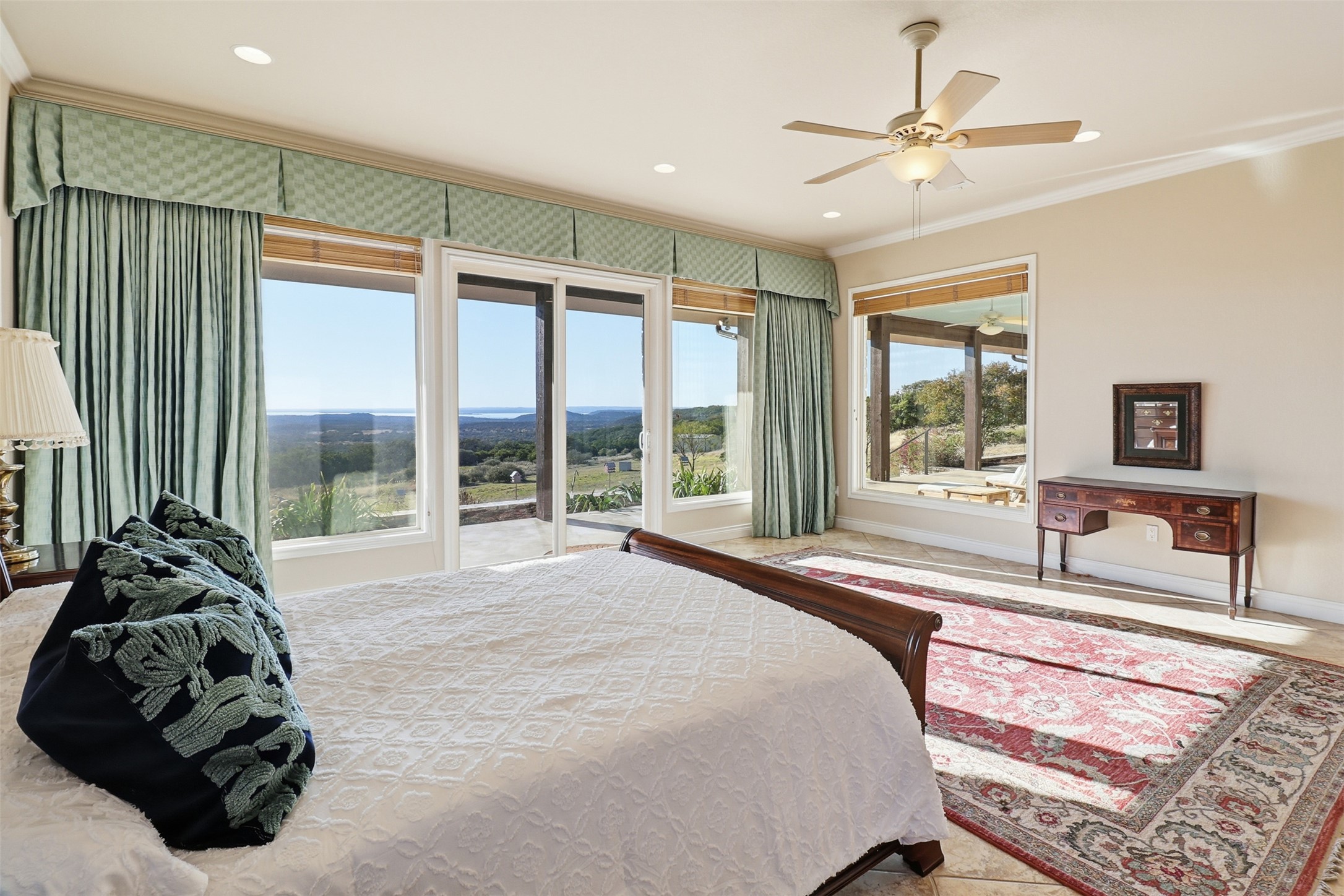450 Threadgill Ranch Road Burnet, TX 78611 - Photo 9 of 33 a spacious bedroom with a bed and glass walk in closet