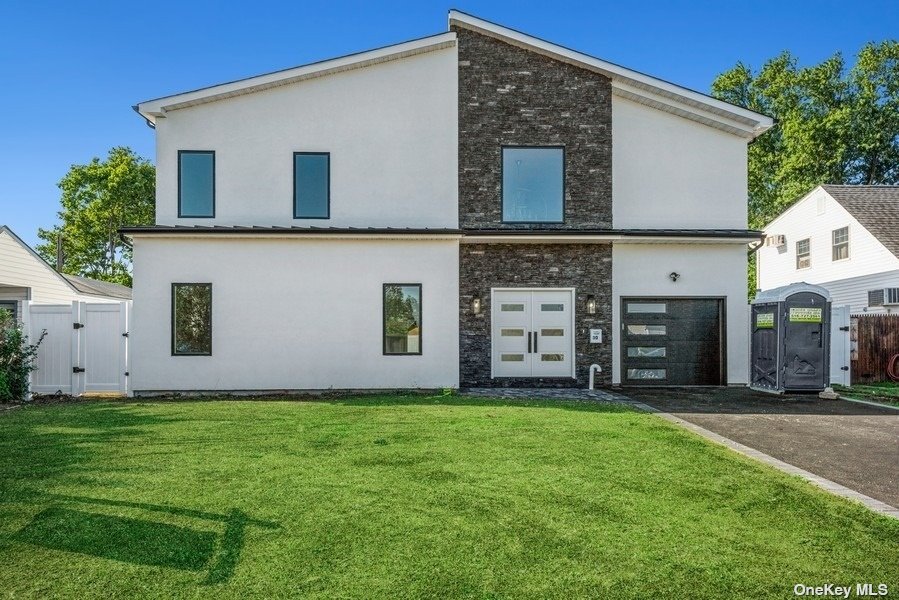 98 Twig Lane Levittown, NY 11756 - Photo 1 of 1 front view of a house with a yard
